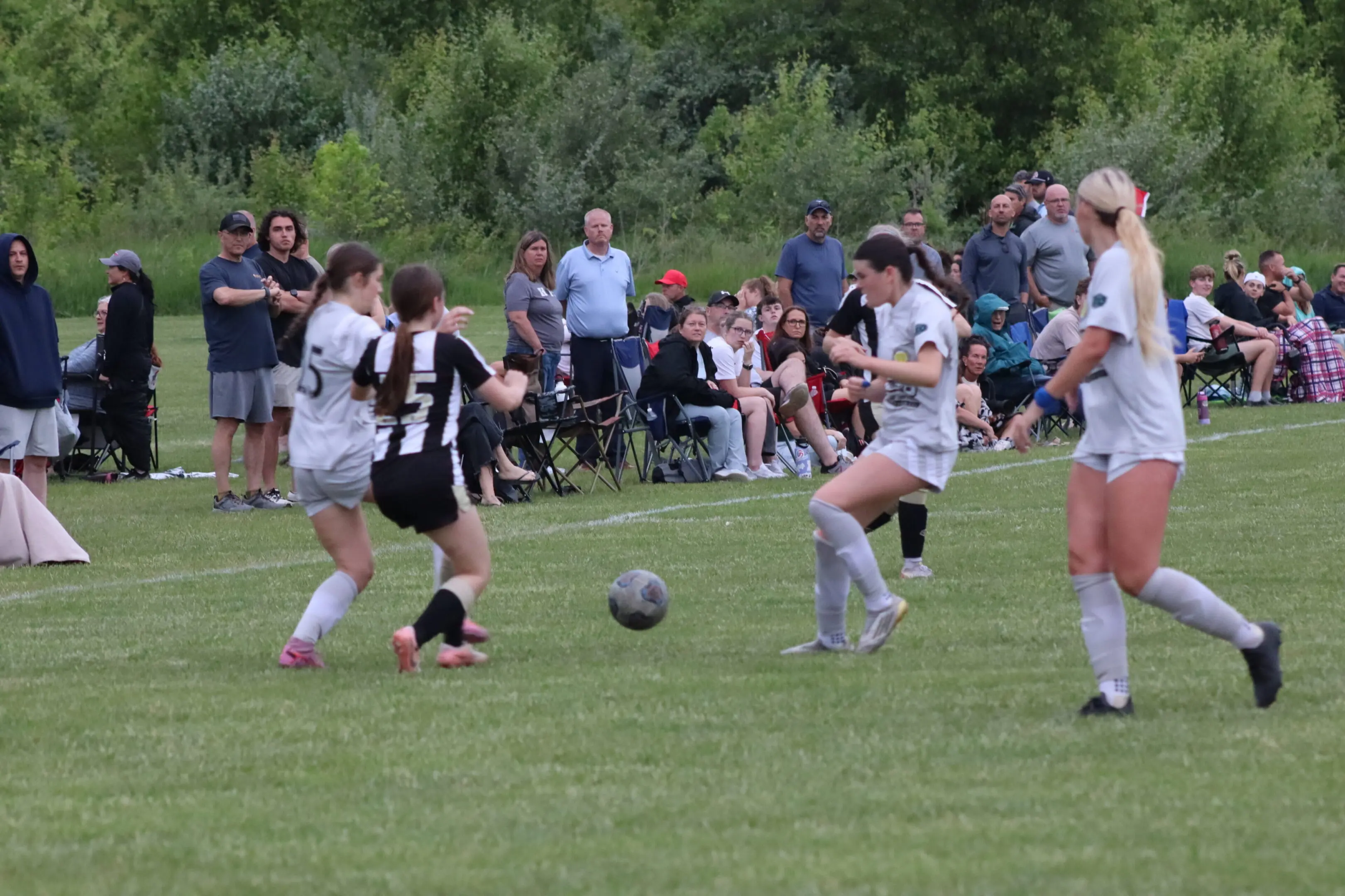 Teenage girls playing soccer.